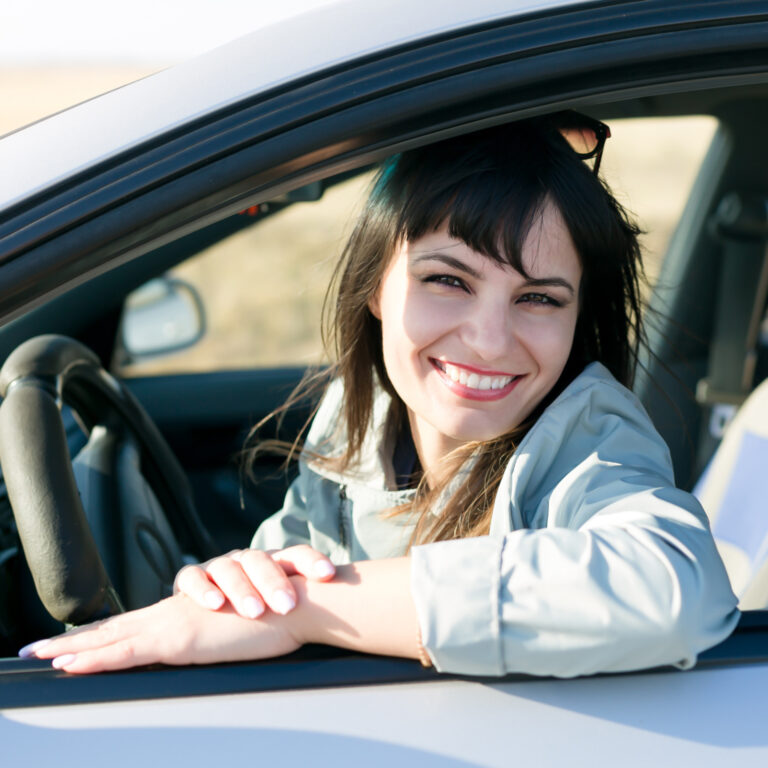 Woman Driving a Rental Car